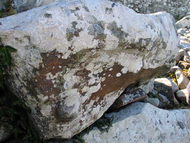 A cobble protrudes from a corbel in the chamber of Creevykeel.