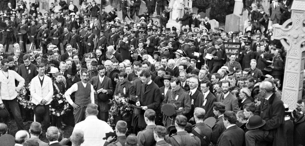 Fr. Michael O'Flanagan and Padraig Pearse standing side by side at the graveside during O'Donovan Rossa's funeral, August 1st, 1916.