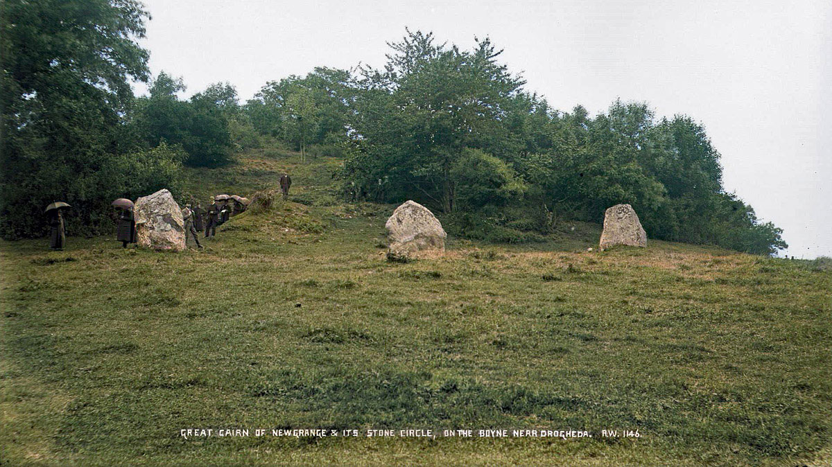 An early image of a group of visitors at Newgrange. Photograph by Robert Welch .