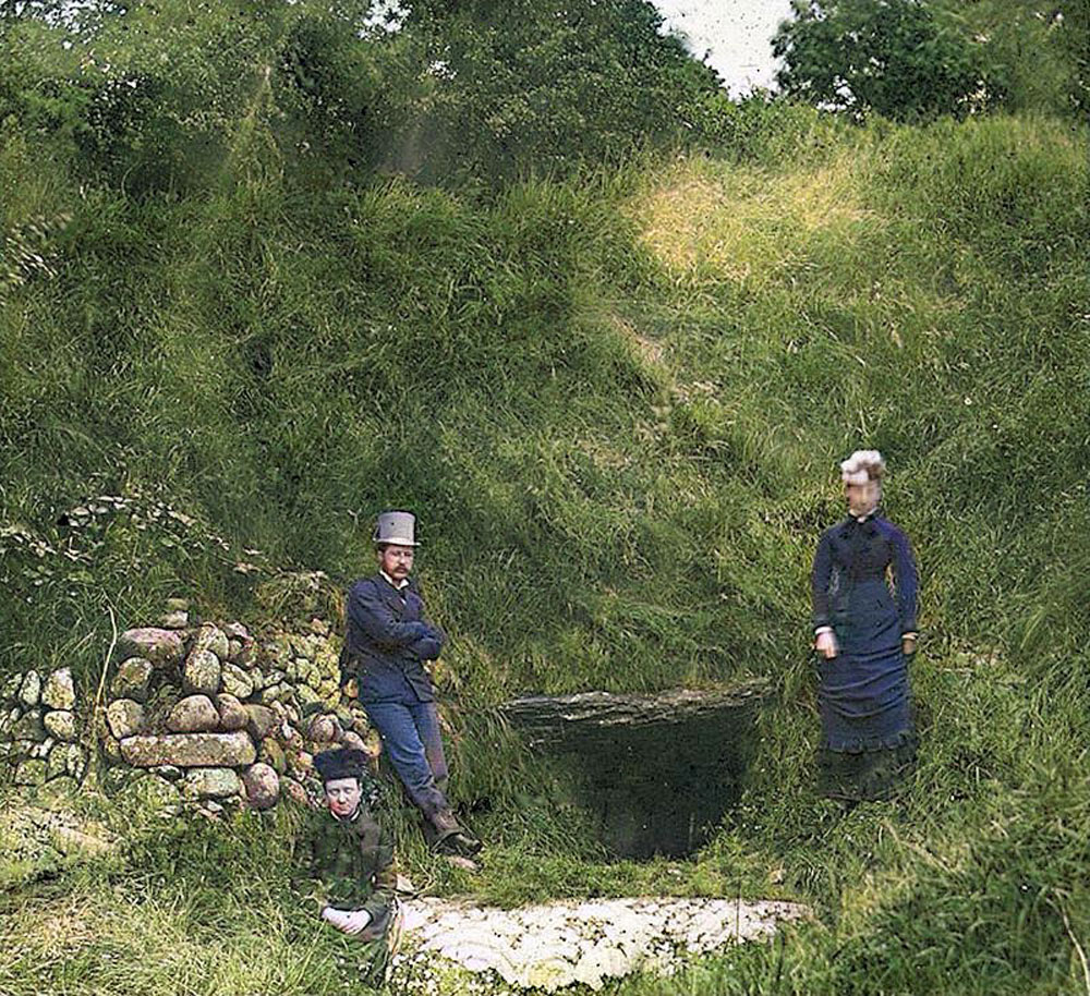 A very early photograph of three Victorian visitors at Newgrange.