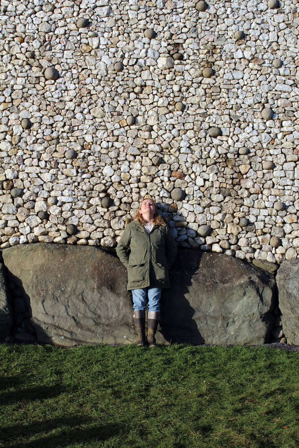 A visitor at Newgrange close to the solstice basking in the rays of the sun.