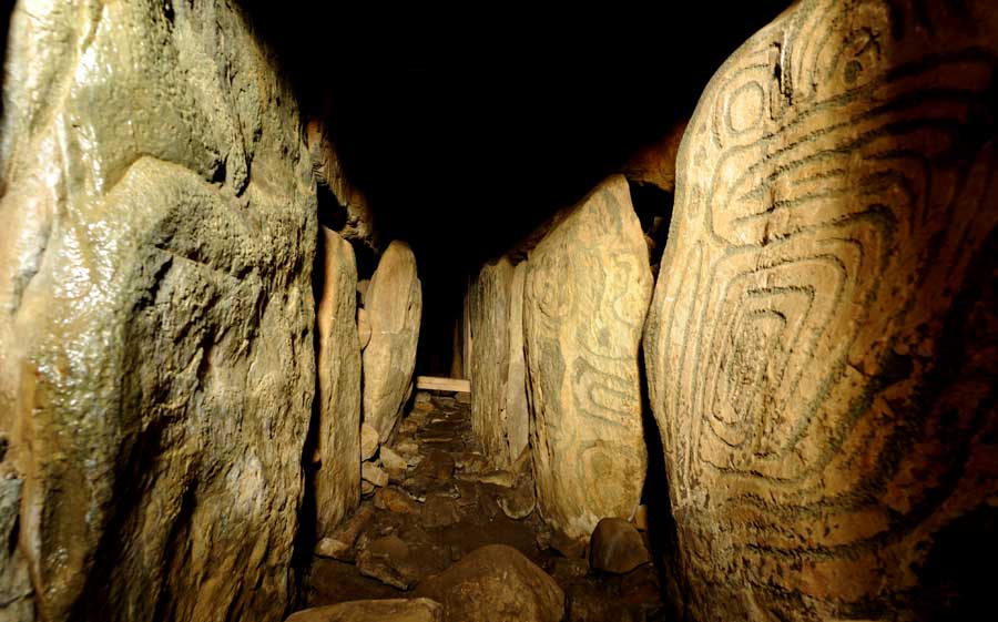 The heavily decorated stone at the bend in the west passage of Knowth.