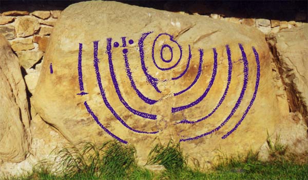 Kerbstone at Knowth with the engraving overlaid with one of Martin Brennan's drawings.