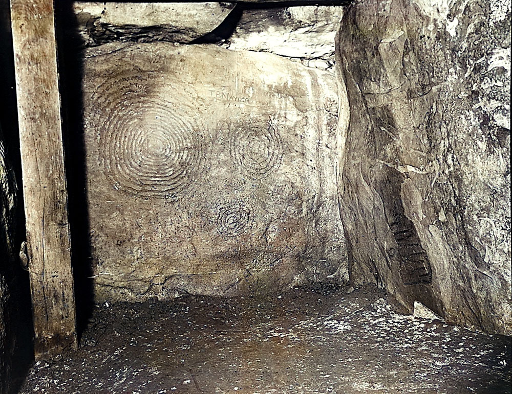 An old photo of the designs in the left recess of the chamber of Newgrange.