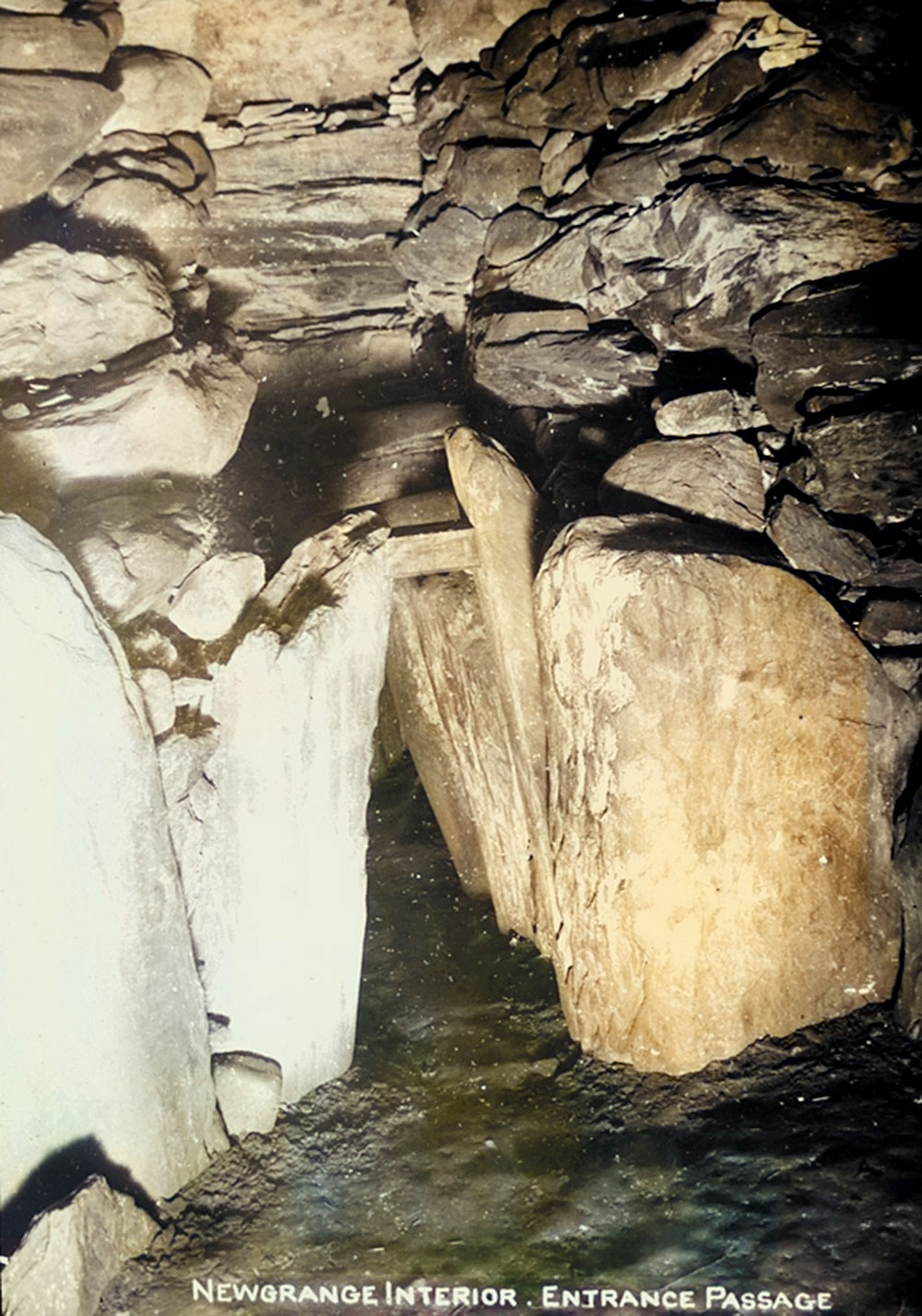 The point where the passage meets the chamber within Newgrange in a pre-restoration photograph of the monument taken by Dublin based photographer Thomas Mason around 1920.