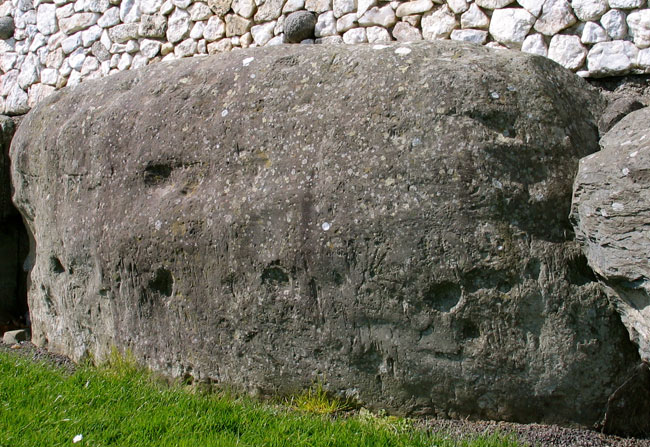 Kerbstone 88 with cup marks and tiny solar engravings.