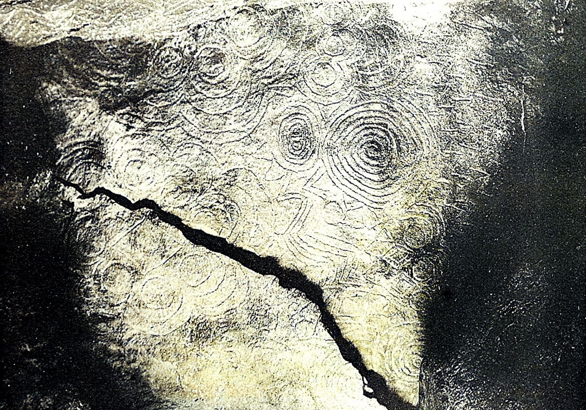 An early photograph of the  complex panel of engravings in the roof of the right-hand recess at Newgrange.