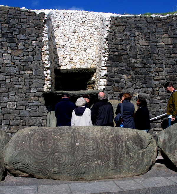Visitors filing in through the Entrance of Newgrange. 