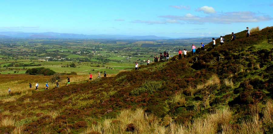 A group of students from the USA descending through the bog after a Sunday morning hike around Carrowkeel.