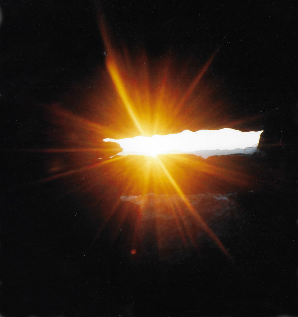 The suns rays shining through the roofbox in Cairn G at Carrowkeel.