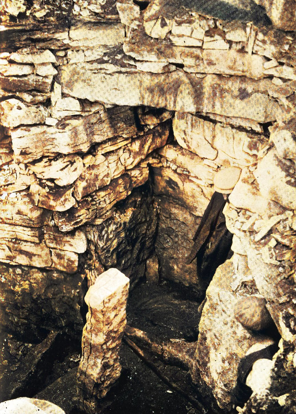The mysterious broken standing stone within the chamber of Cairn F.