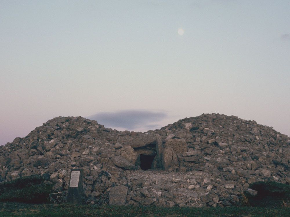 Looking
      into the entrance of Cairn H on the full moon.