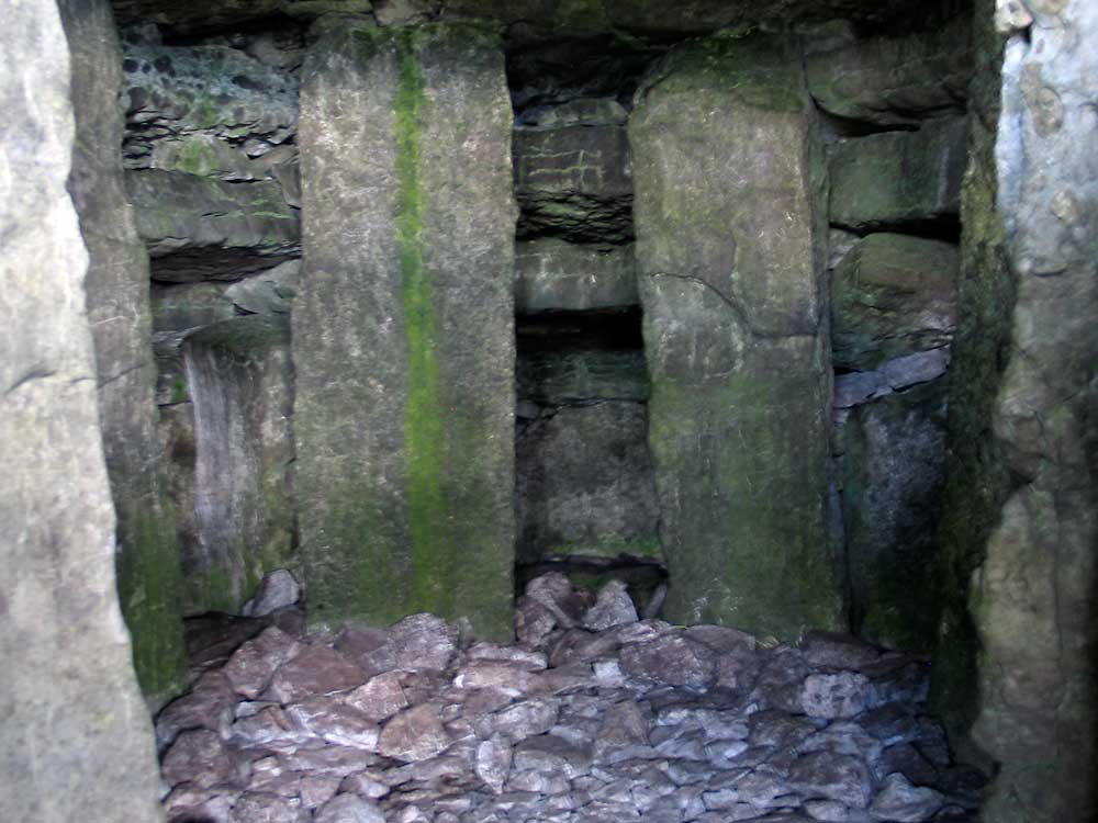 Within the chamber of Cairn G, looking to the end recess.