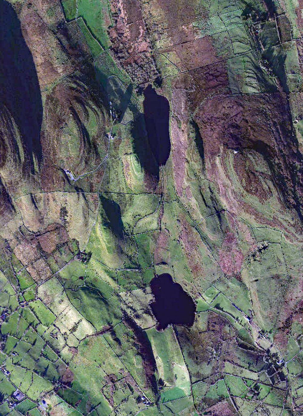 Lough na Leibe and Lough Gowra surrounded by the piglets: Sheecor, Treanmor, Threen and Treanmacmurtagh cairns.