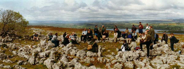 A
     group of archaeology students visit one of the larger huts on the east
     edge of the plateau.