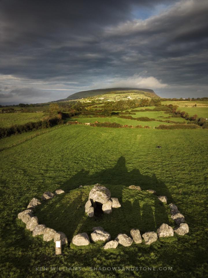 Equinox sunrise over the Kissing Stone at Carrowmore in County Sligo. Photograph © Ken Williams, Shadows and Stone.