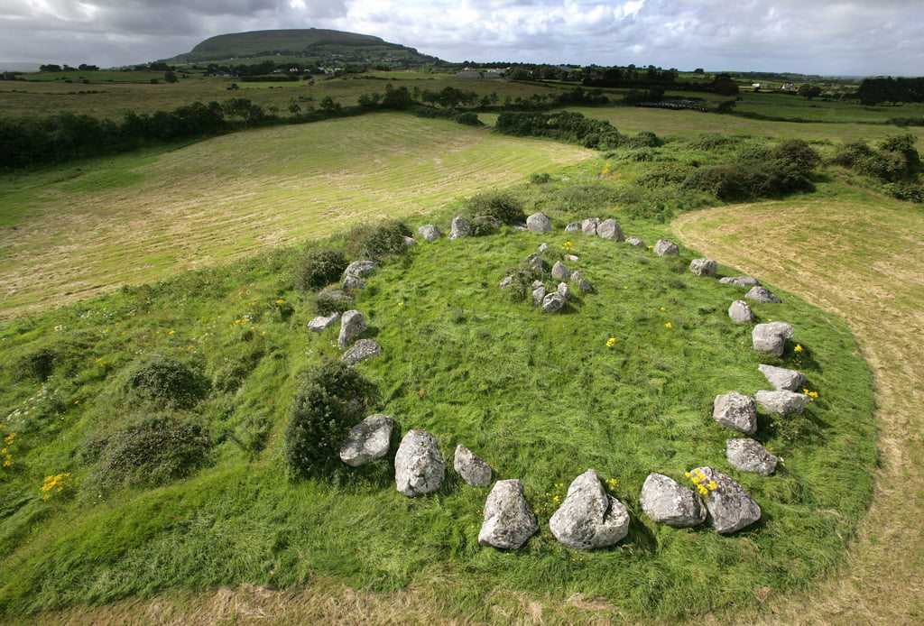 A fantastic photograph of Circle 27 at Carrowmore with Knocknarea beyond.