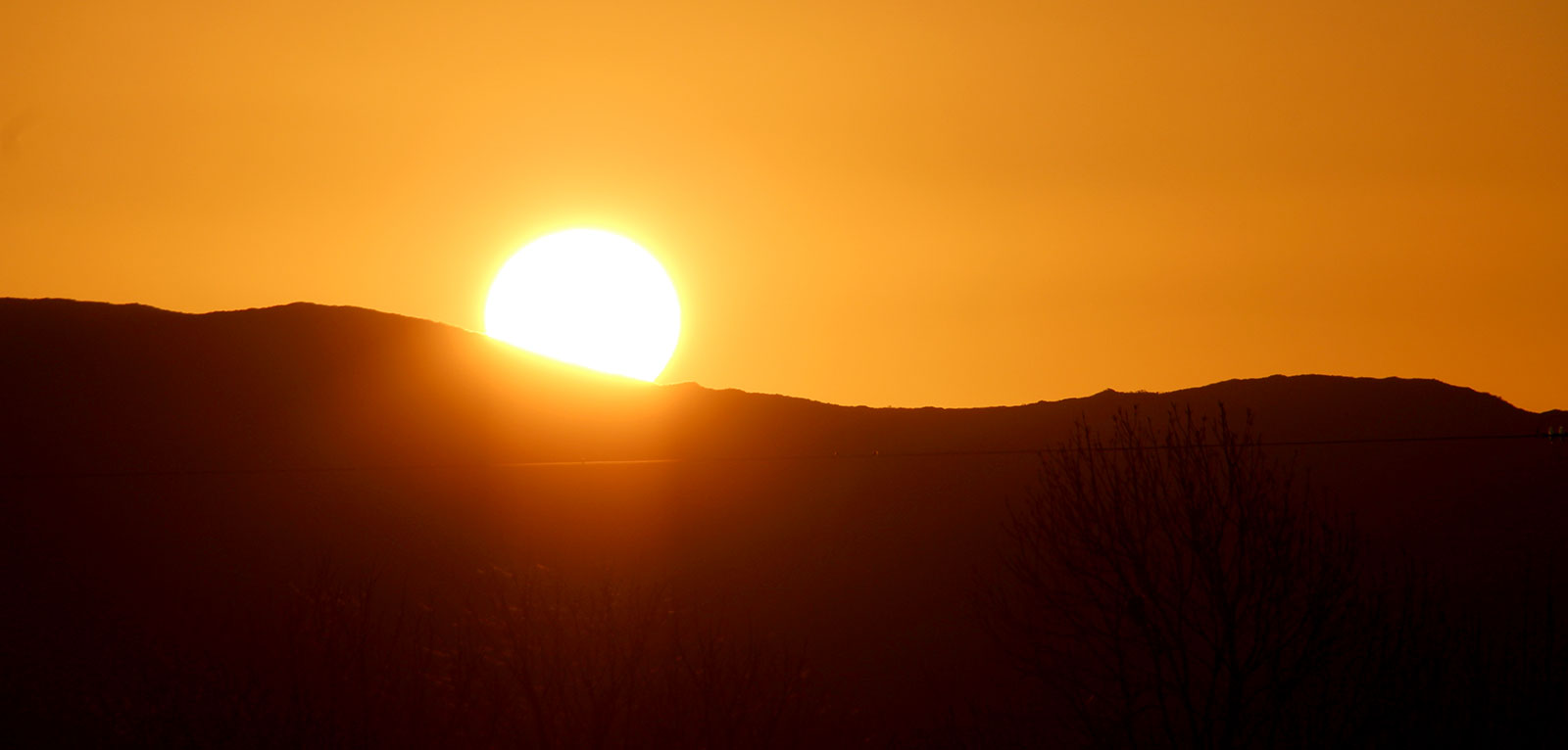 Sunrise on October 31st, view from Listoghil, the central monument at Carrowmore. Photo © Jean Ryan.