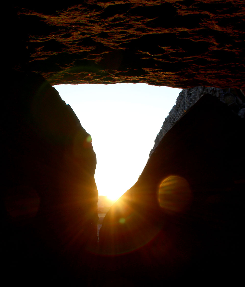 Sunrise at Samhain illuminates the chamber of Listoghil. 