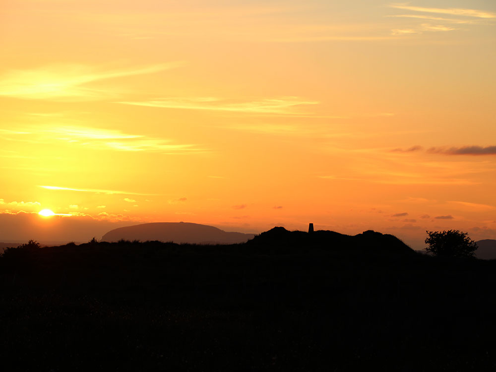 Midsummer sunset from Shee Lugh, the 'three gold coins' of the Mac Oc.