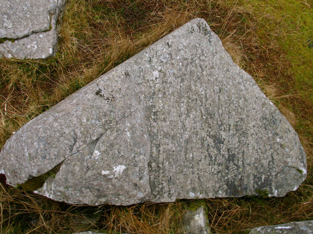 The fallen lintel of the north chamber at the Cloghanmore court cairn.