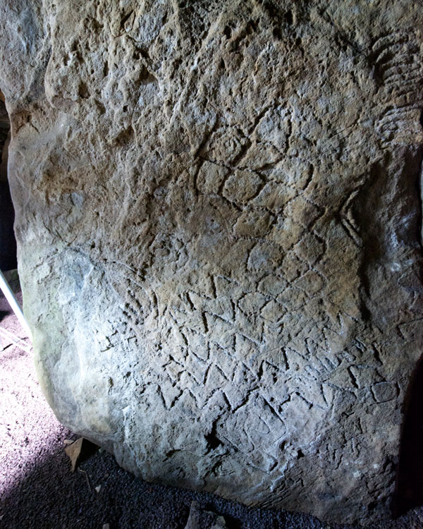 Carvings within Cairn L.