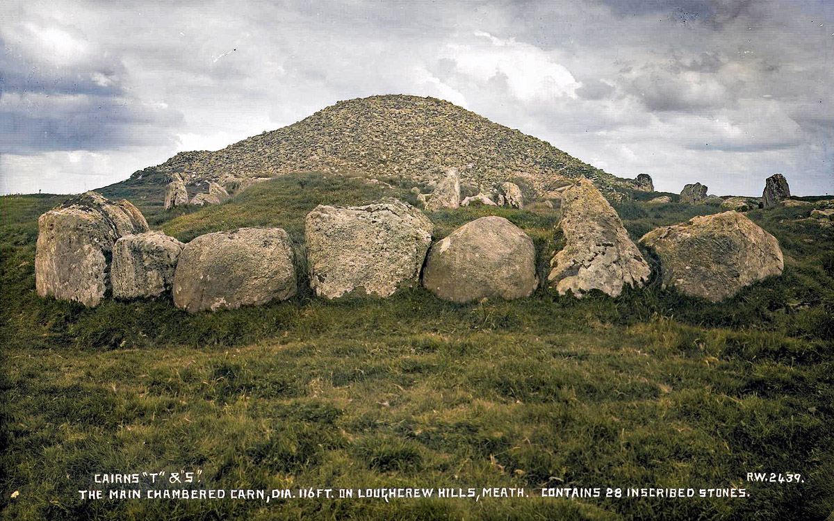 Cairn S and Cairn T at Loughcrew photograph by Robert Welch. Caption: The main chambered cairn, diameter 116 feet, on Loughcrew Hills, Meath. Contains 28 inscribed stones.