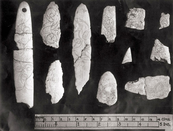 Carved slips of cattle-bone from Cairn H.