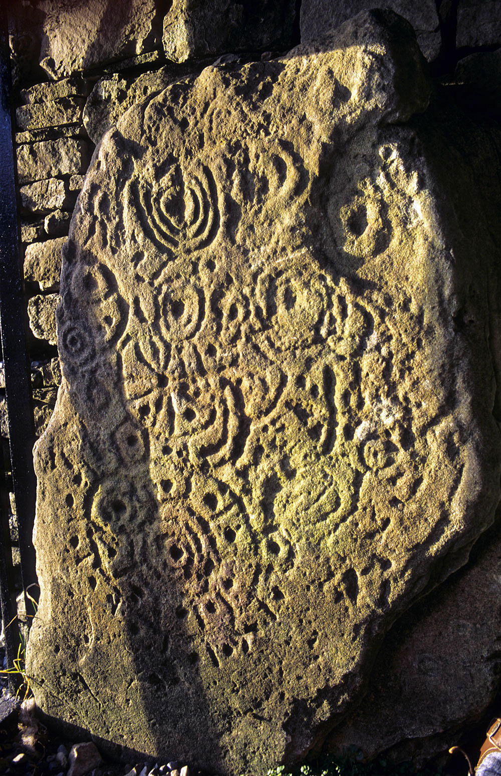 Decorated stone in the entryway to Cairn T.