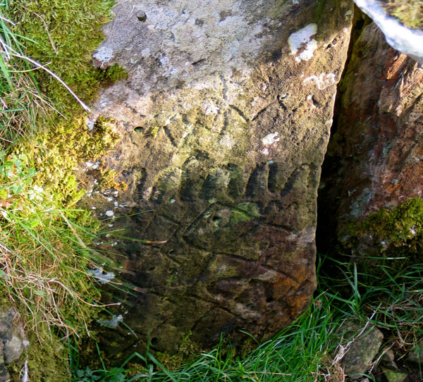 Engravings within Cairn F.