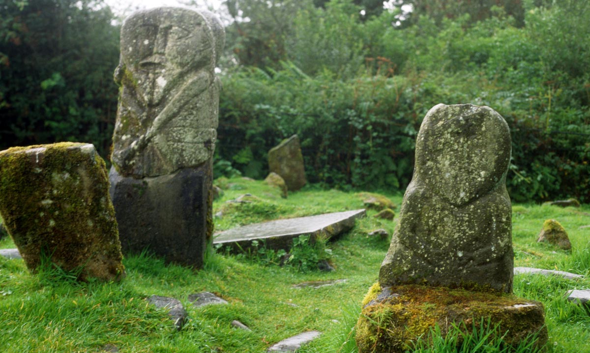 The two statues in the graveyard at Boa Island.