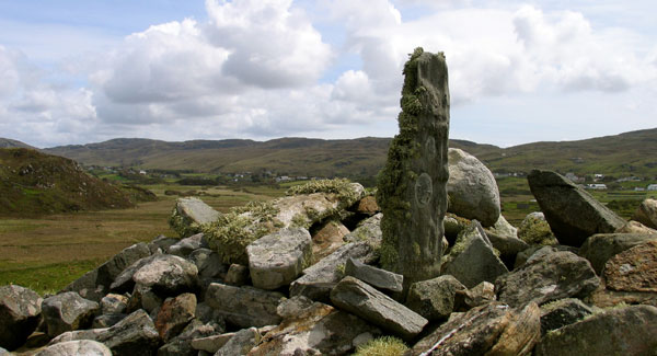 A small weathered cross slab at the west end of the valley near Columba's church.