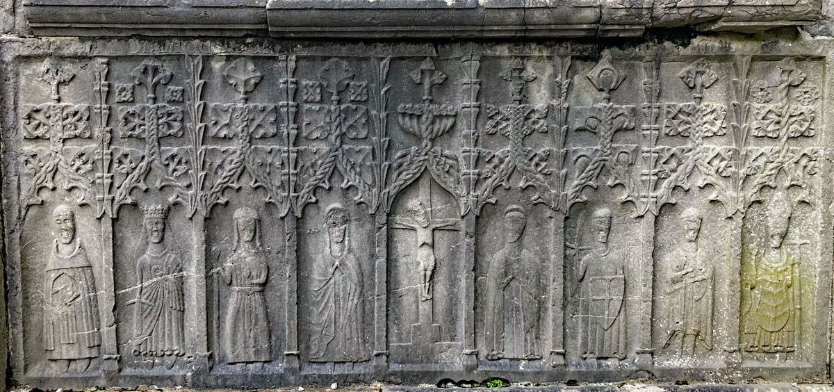The nine figures carved on the base of the O'Crean Memorial in Sligo Abbey, which dates to 1506.