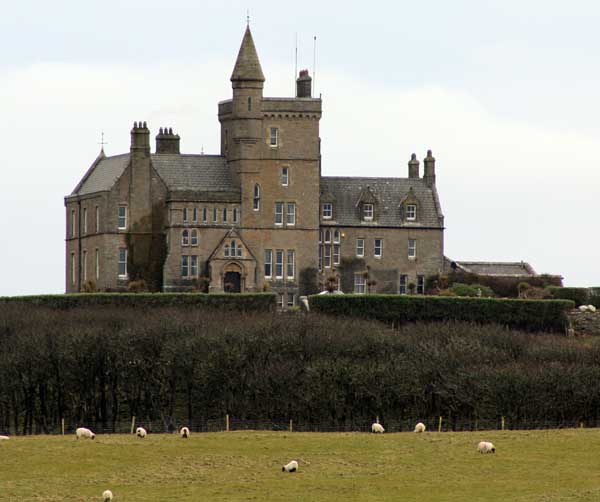 The east facade of the castle from the outcrop called the Fairy Rocks .