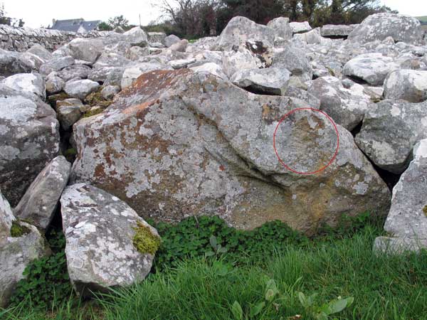 Engravings on a kerb-stone at Creevykeel.